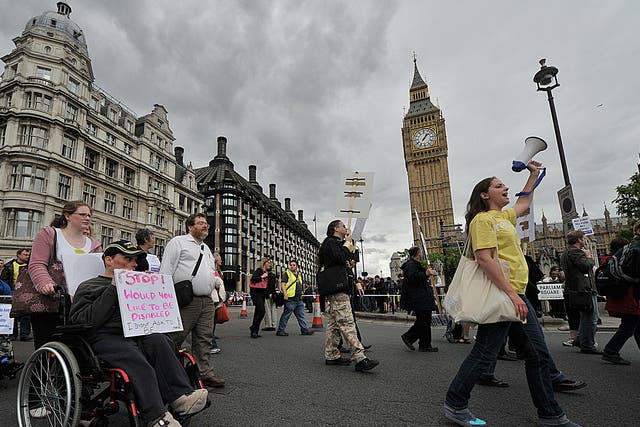 Disabled protestors demonstrate past the Houses of Parliament in 2011