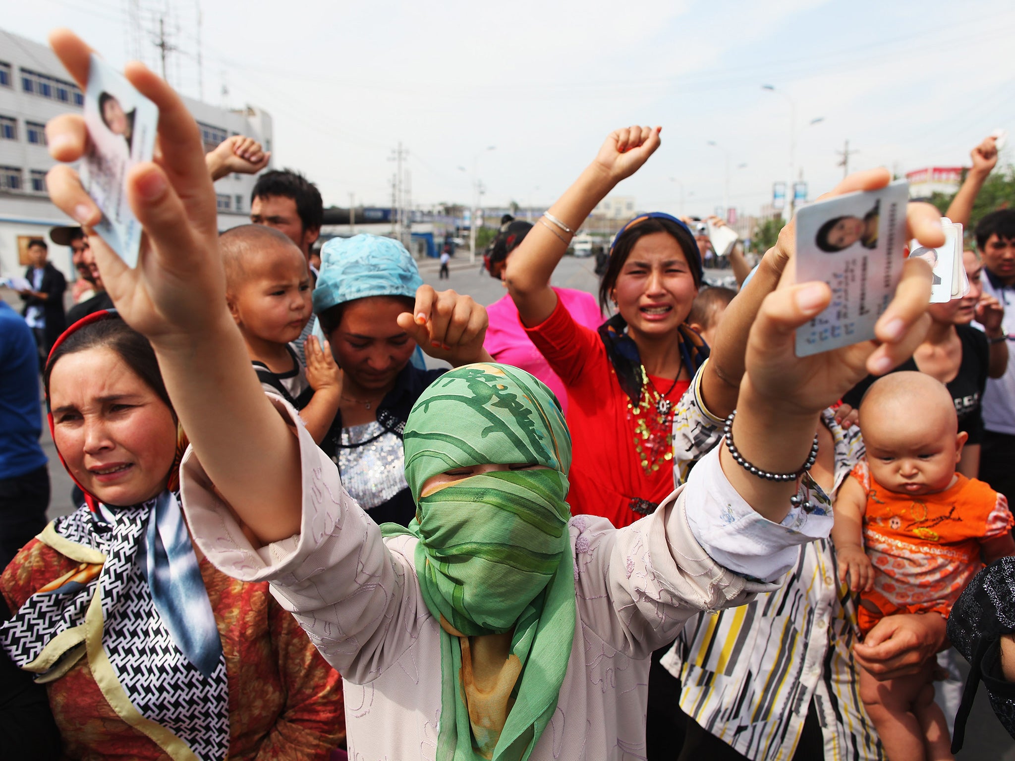 Uighur women protest against the Chinese government in Urumqi, the capital of Xinjiang Uighur autonomous region