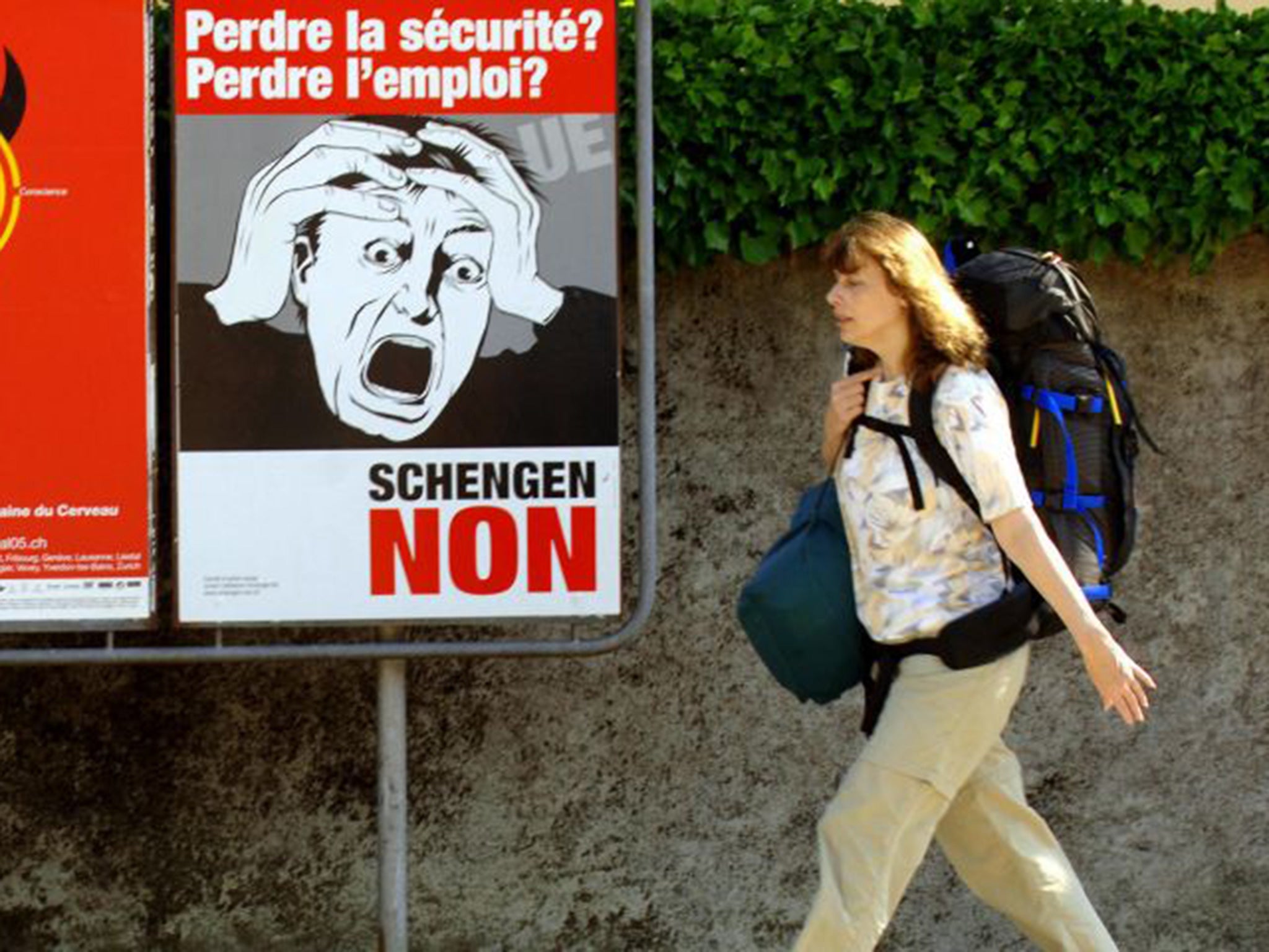 Posters advertising a referendum poster on the Schengen treaty in Nyom
