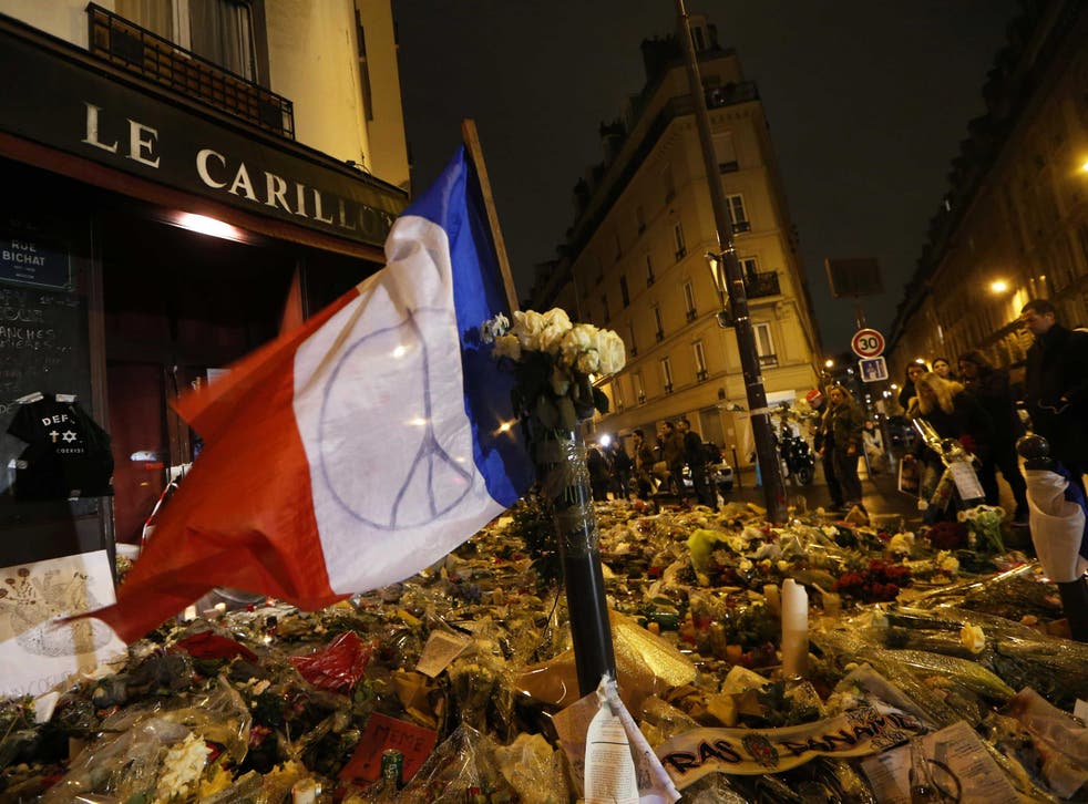 Parisians lit candles and paid tribute to the 130 victims of the bloody attacks