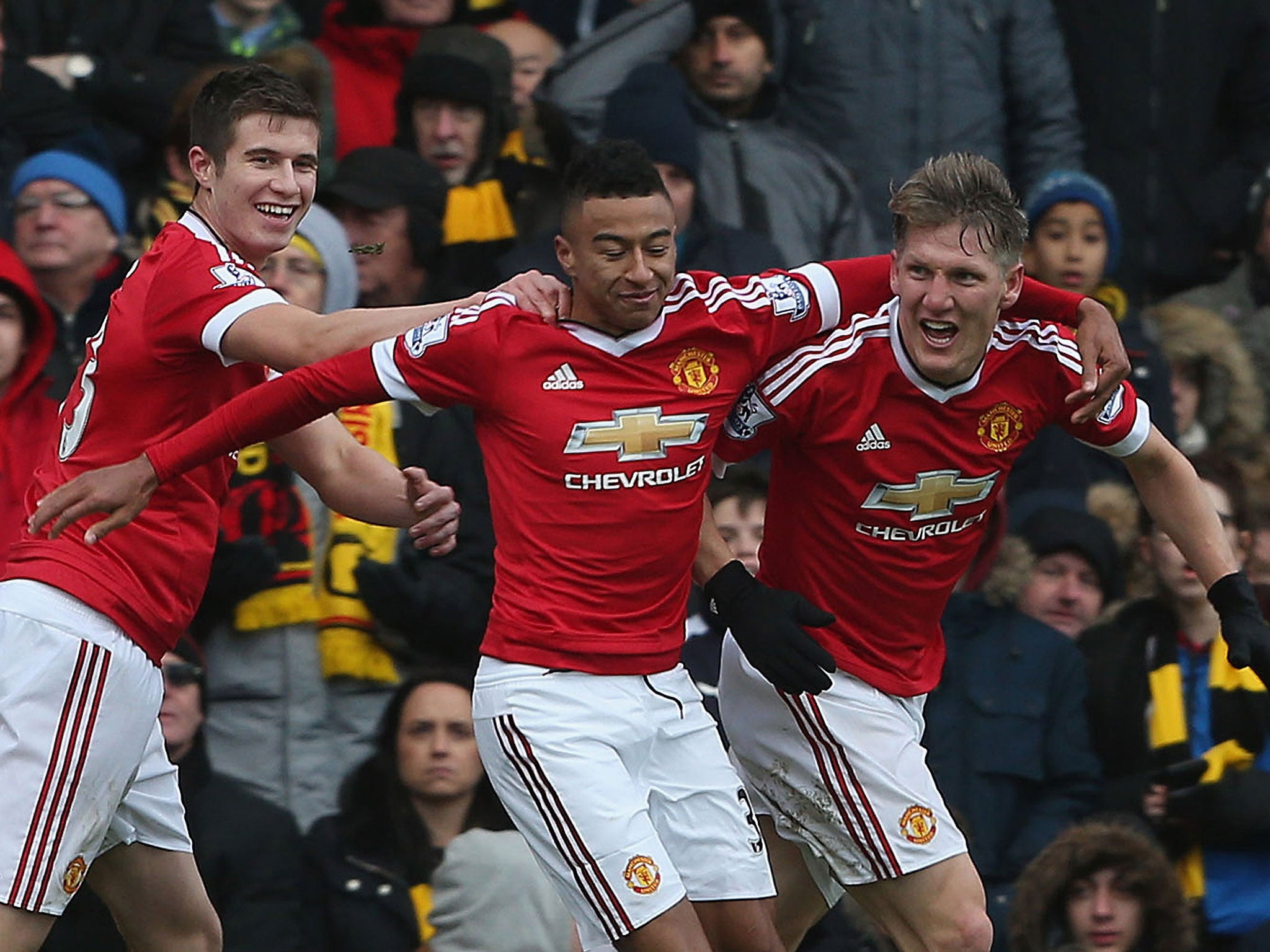 Manchester United celebrate Bastian Schweinsteiger's late effort that went in off Troy Deeney to secure victory over Watford