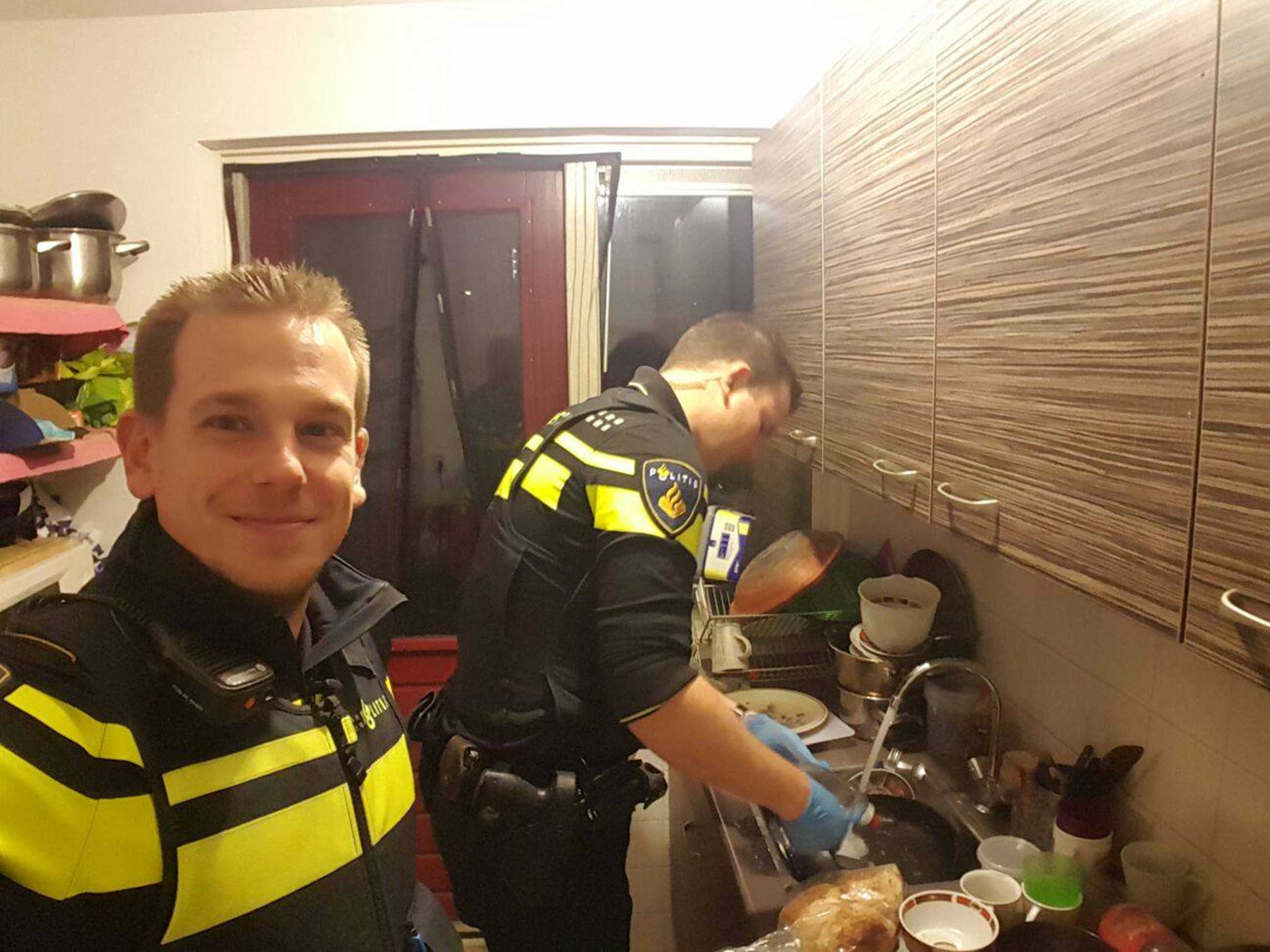 The two officers in the kitchen