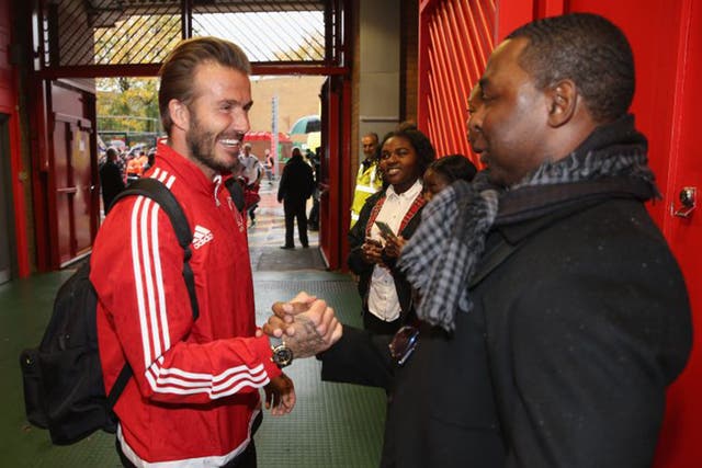 Andy Cole, with David Beckham at last weekend’s Unicef match, was abused over his illness
