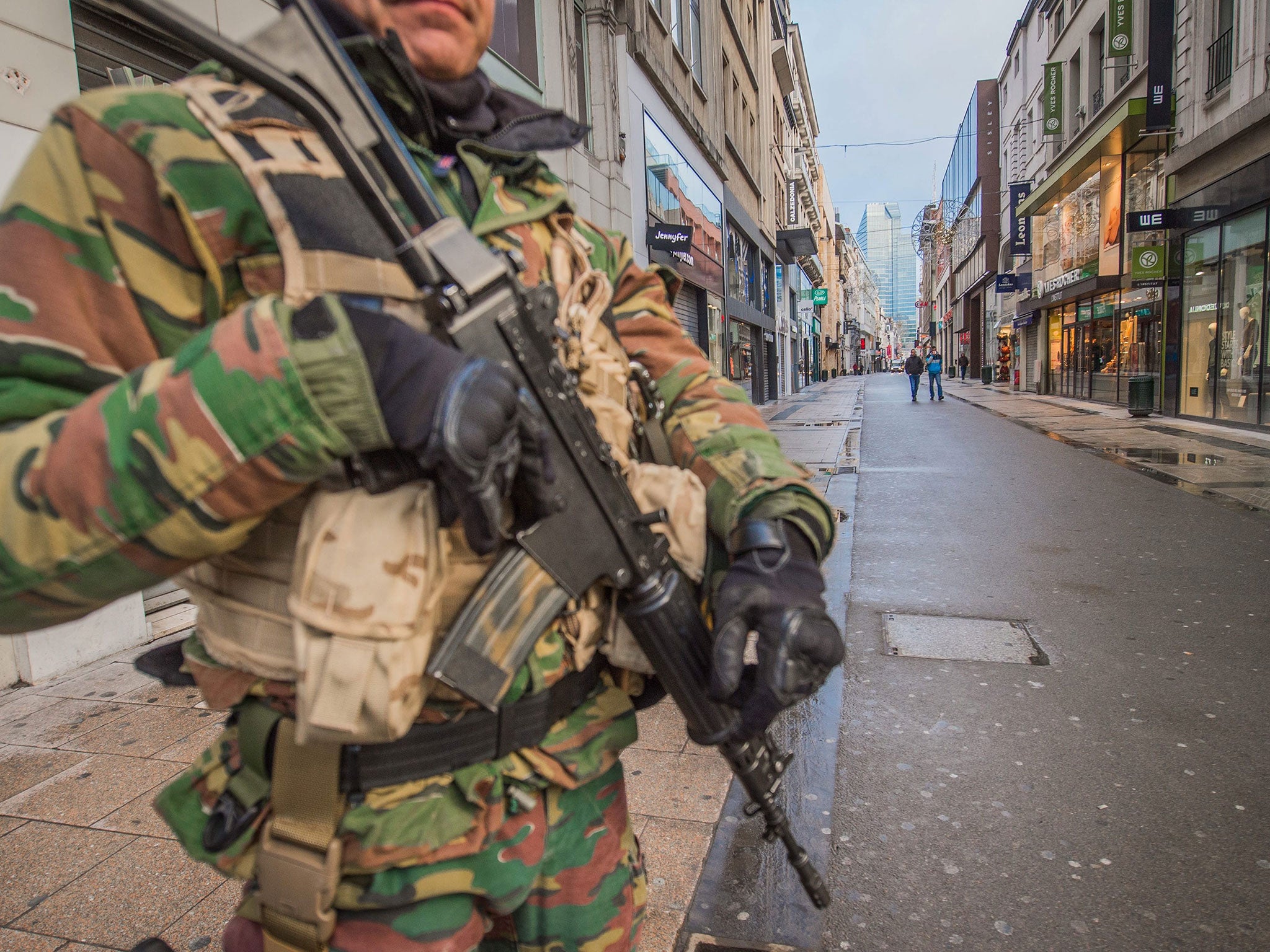A Belgian soldier stands guard in Rue Neuve, the busiest shopping street in Brussels, now empty due to the terror alert level being elevated to 4/4, in Brussels, Belgium, 21 November 2015