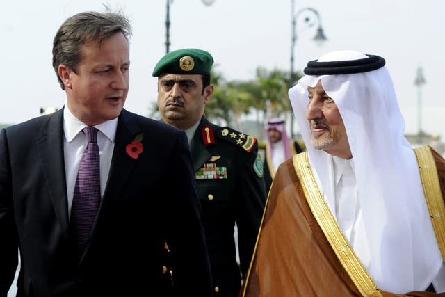 Saudi Emir of Mecca, Prince Khalid bin Faisal bin Abdulaziz (R) welcomes British Prime Minister David Cameron to Saudi Arabia in 2012