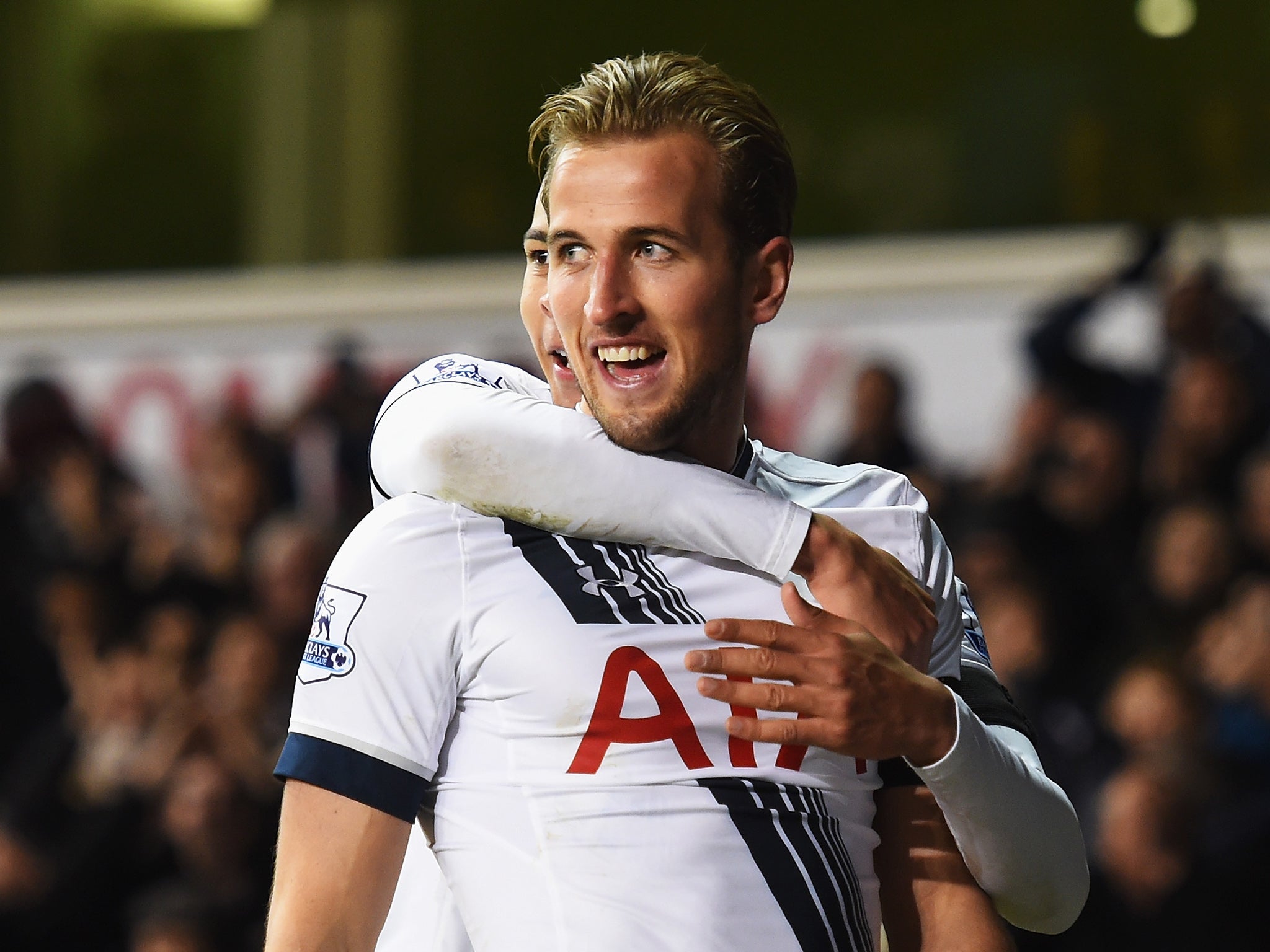 Harry Kane celebrates his second with team-mate Dele Alli