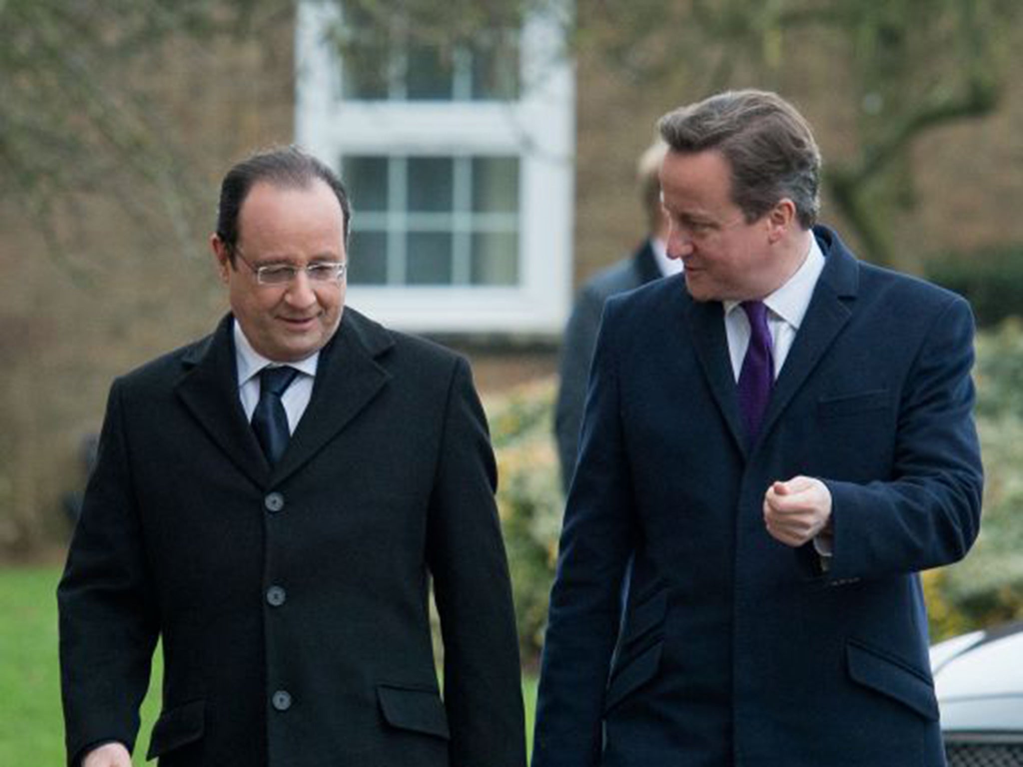 Prime Minister David Cameron walking with French President Francois Hollande