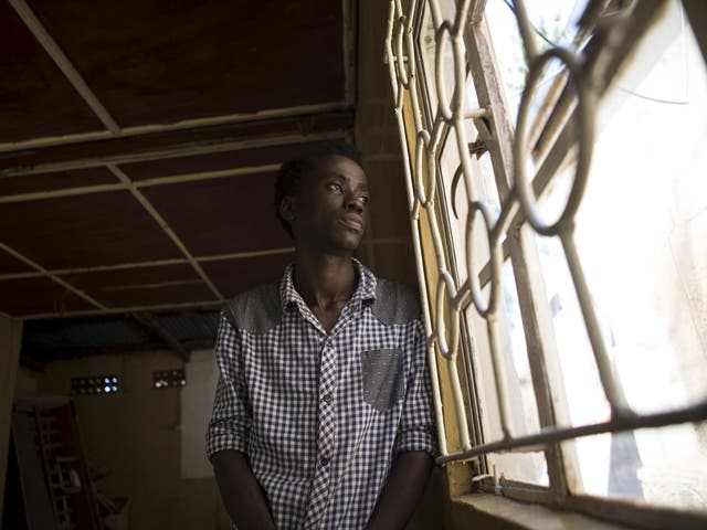 Francis, a member of the gay community, poses for a photograph at an undisclosed location in Uganda's capital Kampala. He says: 'Pope Francis visiting Uganda is one of the most exciting things to have happened to me'