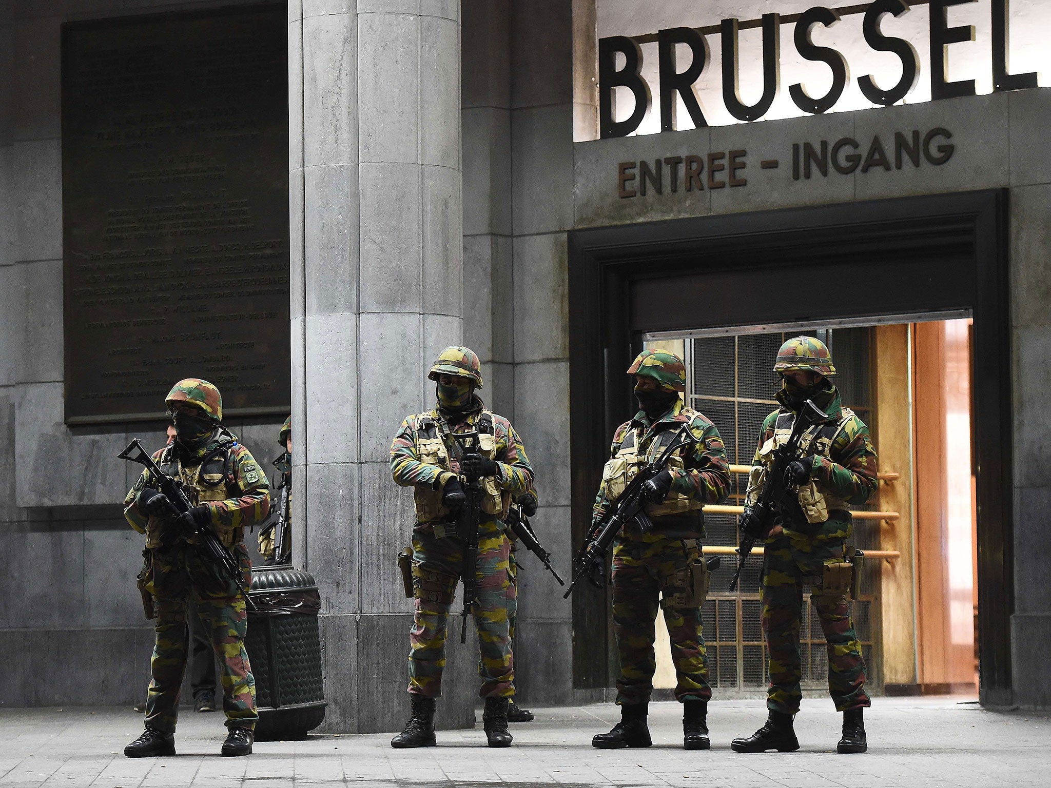 Soldiers stand guard in front of the central train station in Brussels, as the Belgian capital remained on the highest security alert level over fears of a Paris-style attack