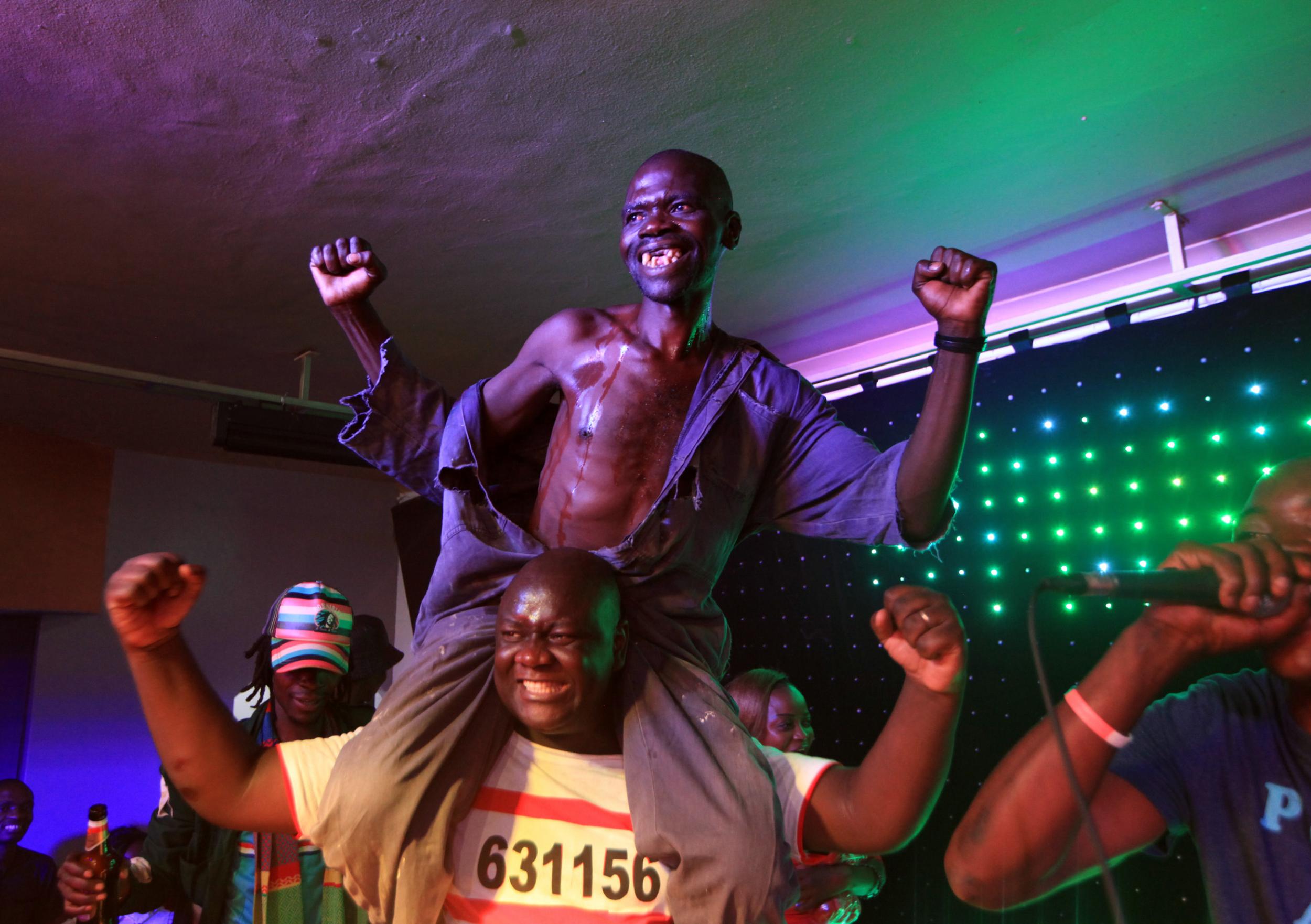 Mison Sere celebrates winning the Mr Ugly competition