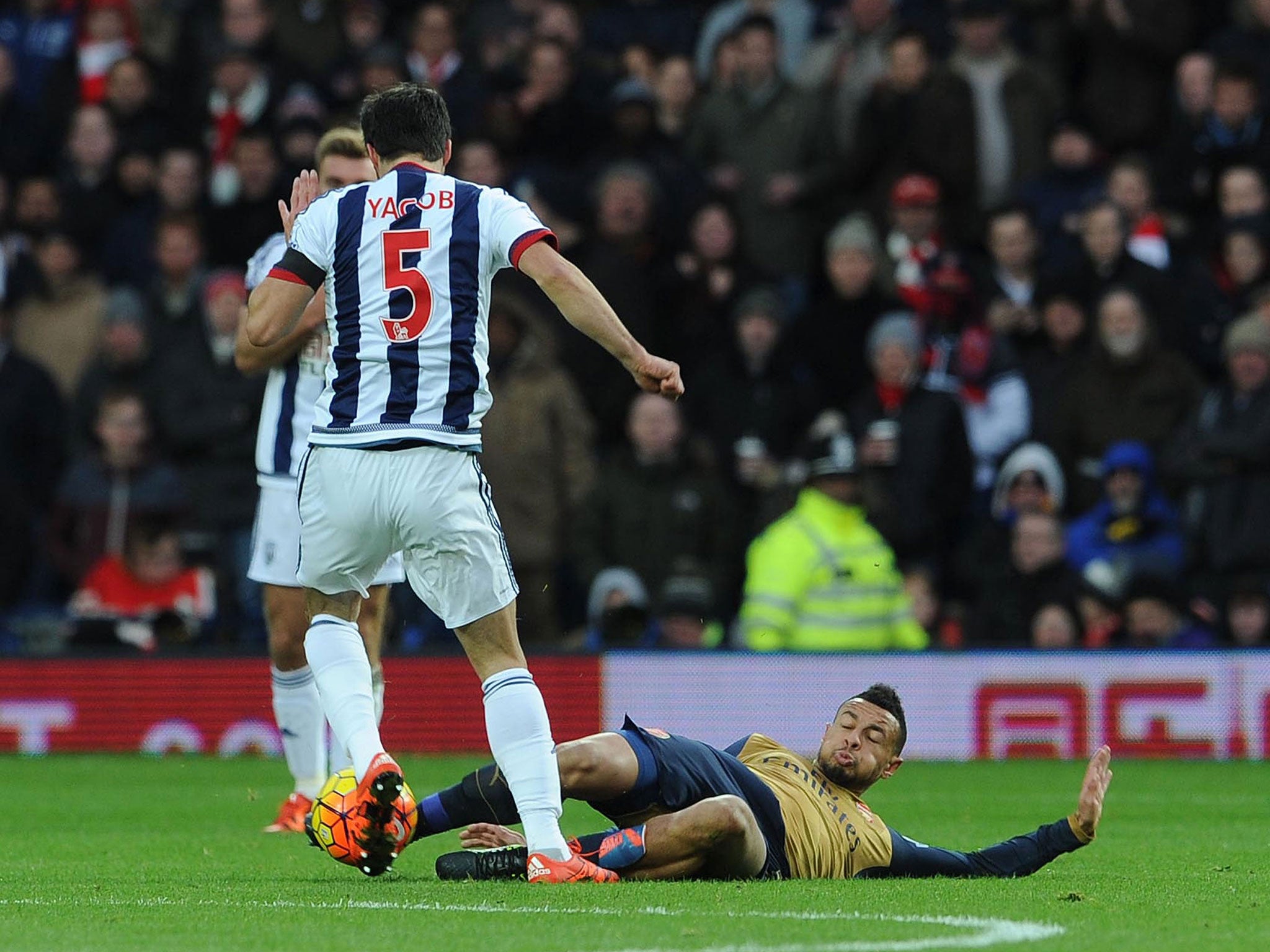 Francis Coquelin slide the ball and suffers knee ligament damage in West Brom defeat