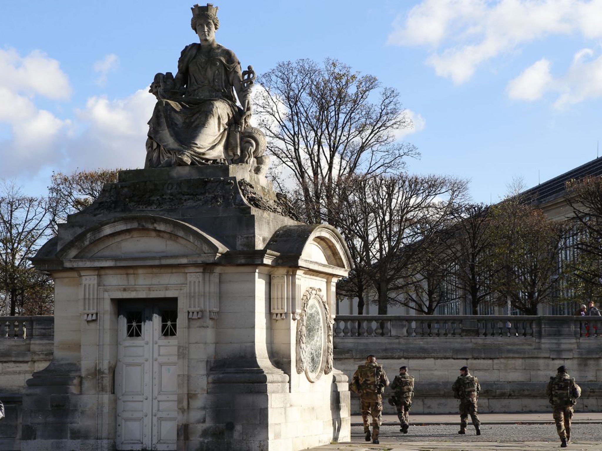 French soldiers patrol in Concorde Plaza closed to the Champs Elysees, in Paris
