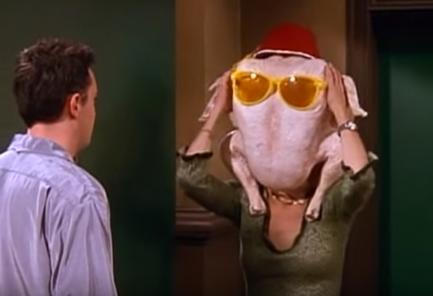 Monica puts a Thanksgiving turkey on her head in a bid to cheer up Chandler in Friends