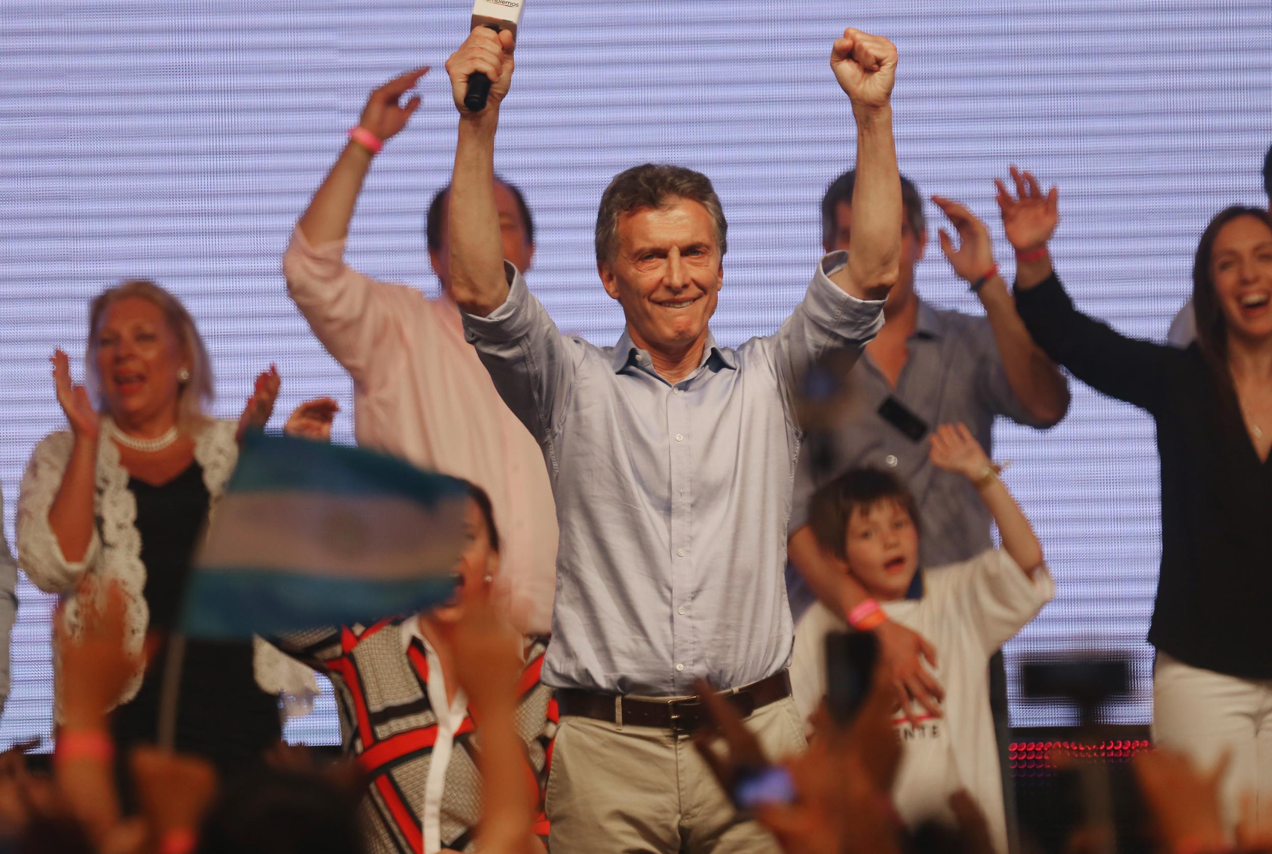 Opposition presidential candidate Mauricio Macri celebrates after defeating ruling party candidate Daniel Scioli