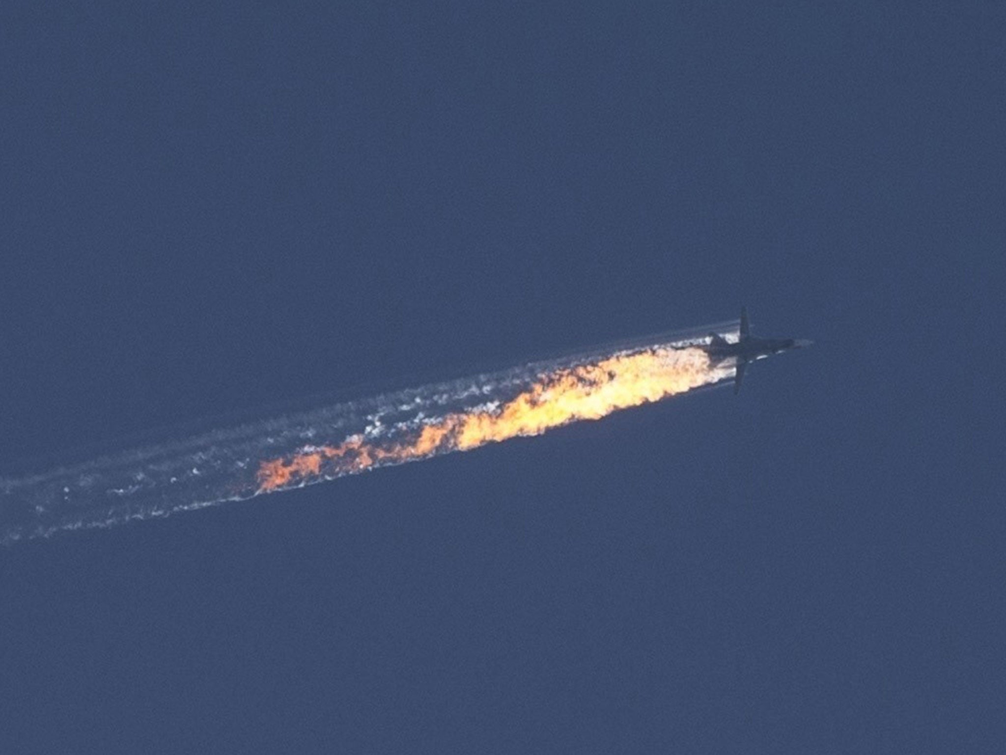 A trail of flames is seen behind the jet after it was struck by the Turkish military
