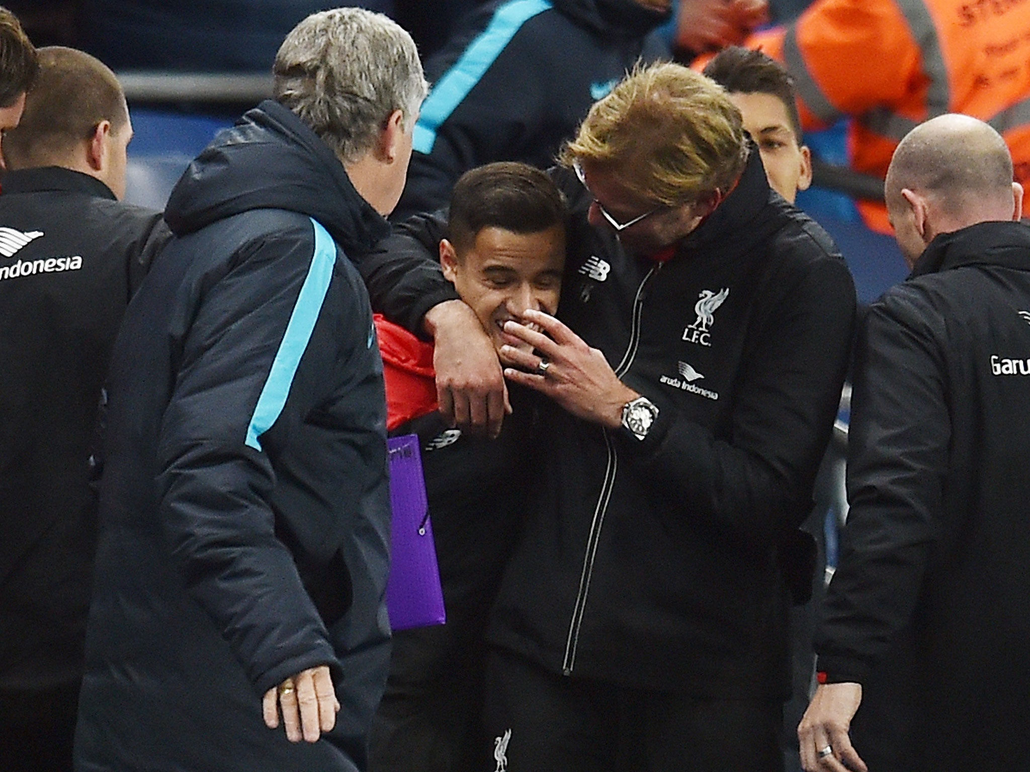 Jurgen Klopp gives Philippe Coutinho a hug during the win over Manchester City
