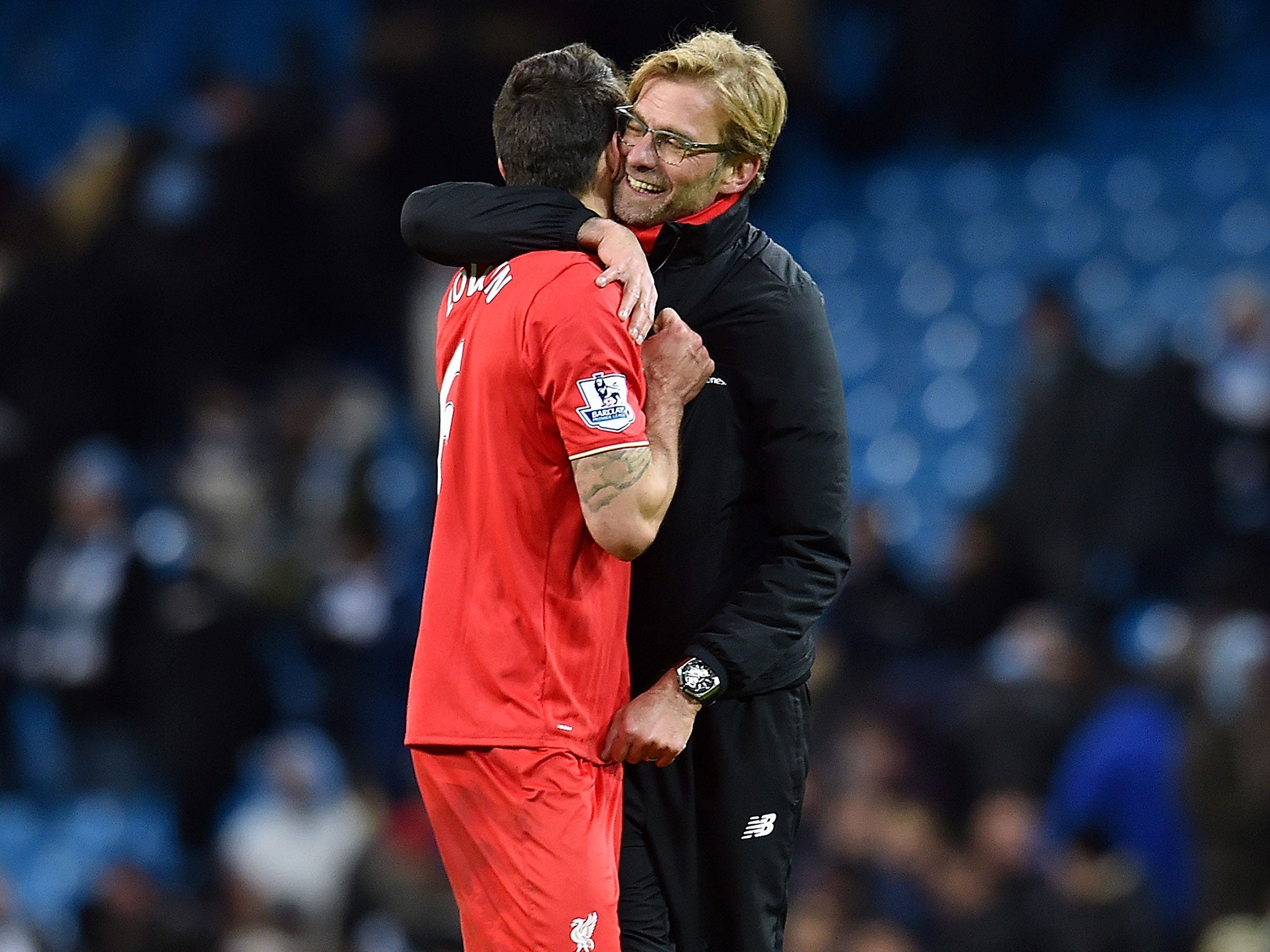 Klopp then hugged Liverpool defender Dejan Lovren...