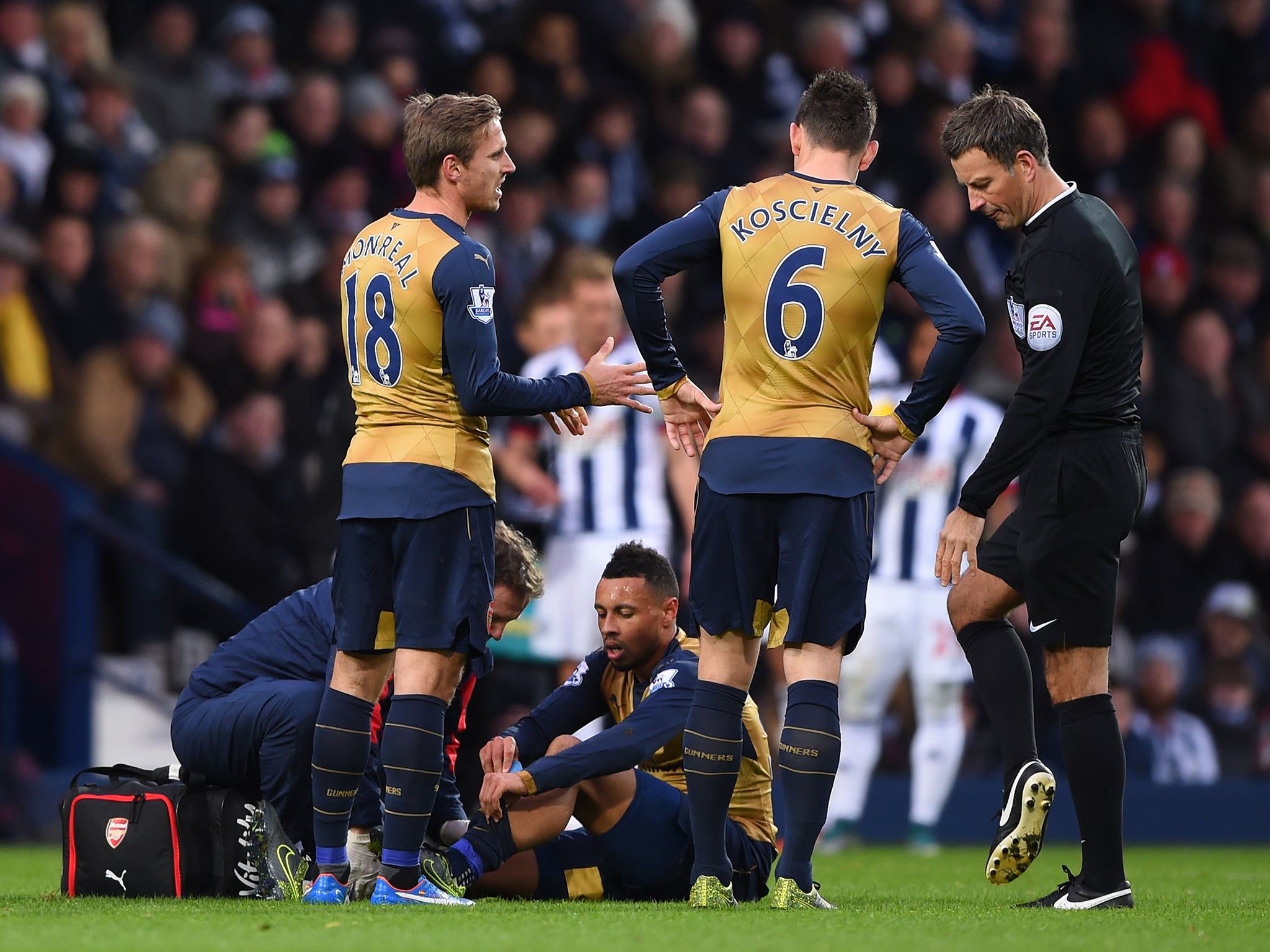 Francis Coquelin (centre) suffered knee ligament damage in West Brom defeat in November