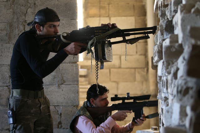 Free Syrian Army fighters take on the Syrian military in the town of Maarat al-Nuaman 