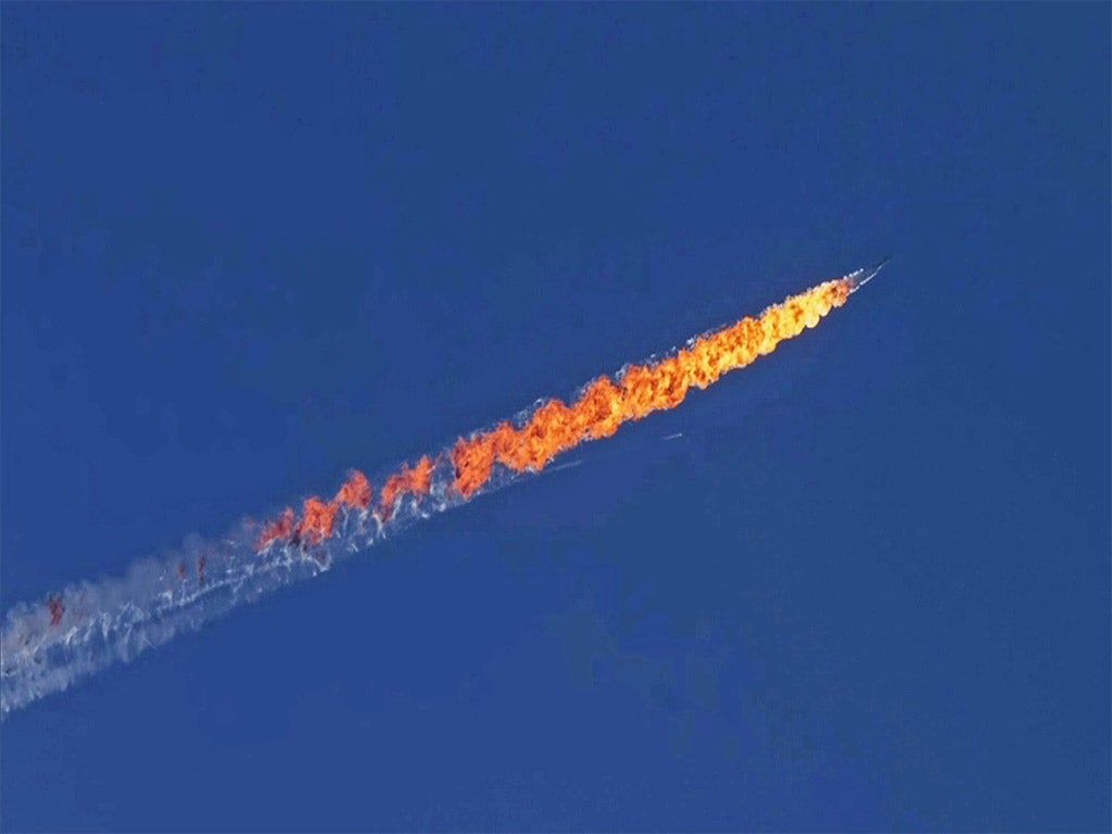 Footage released on Tuesday shows a Russian Su-24 fighter jet near the Turkey-Syria border after it had been hit by an air-to-air missile fired from Turkish F-16 jets