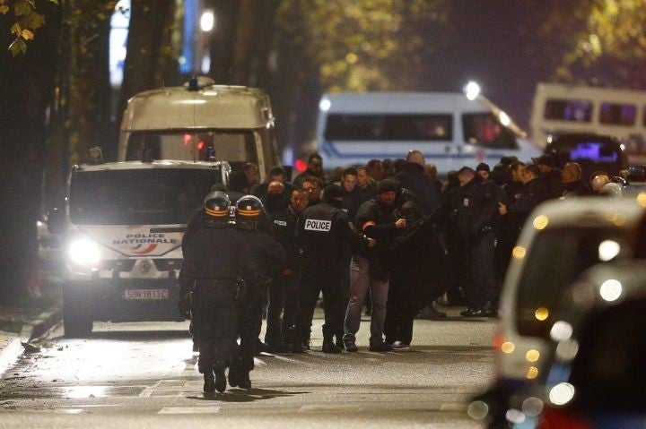 Police officers at the scene of the hostage situation in Roubaix, France