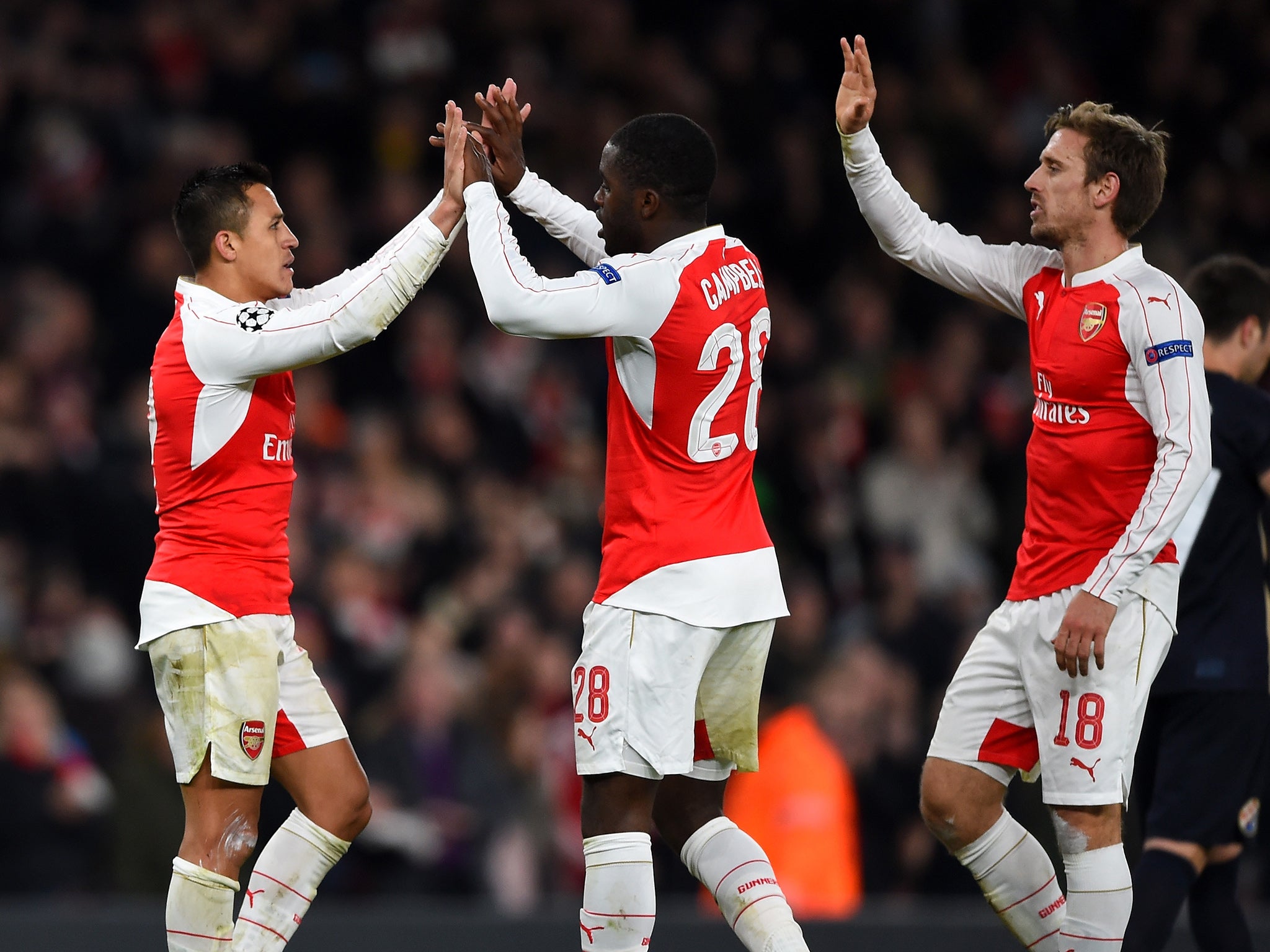 Alexis Sanchez is congratulated on his second goal