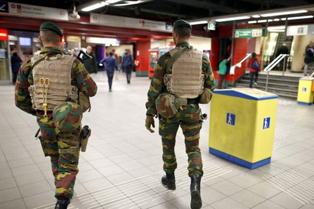 Belgian soldiers patrol at the Central Station subway stop in Brussels