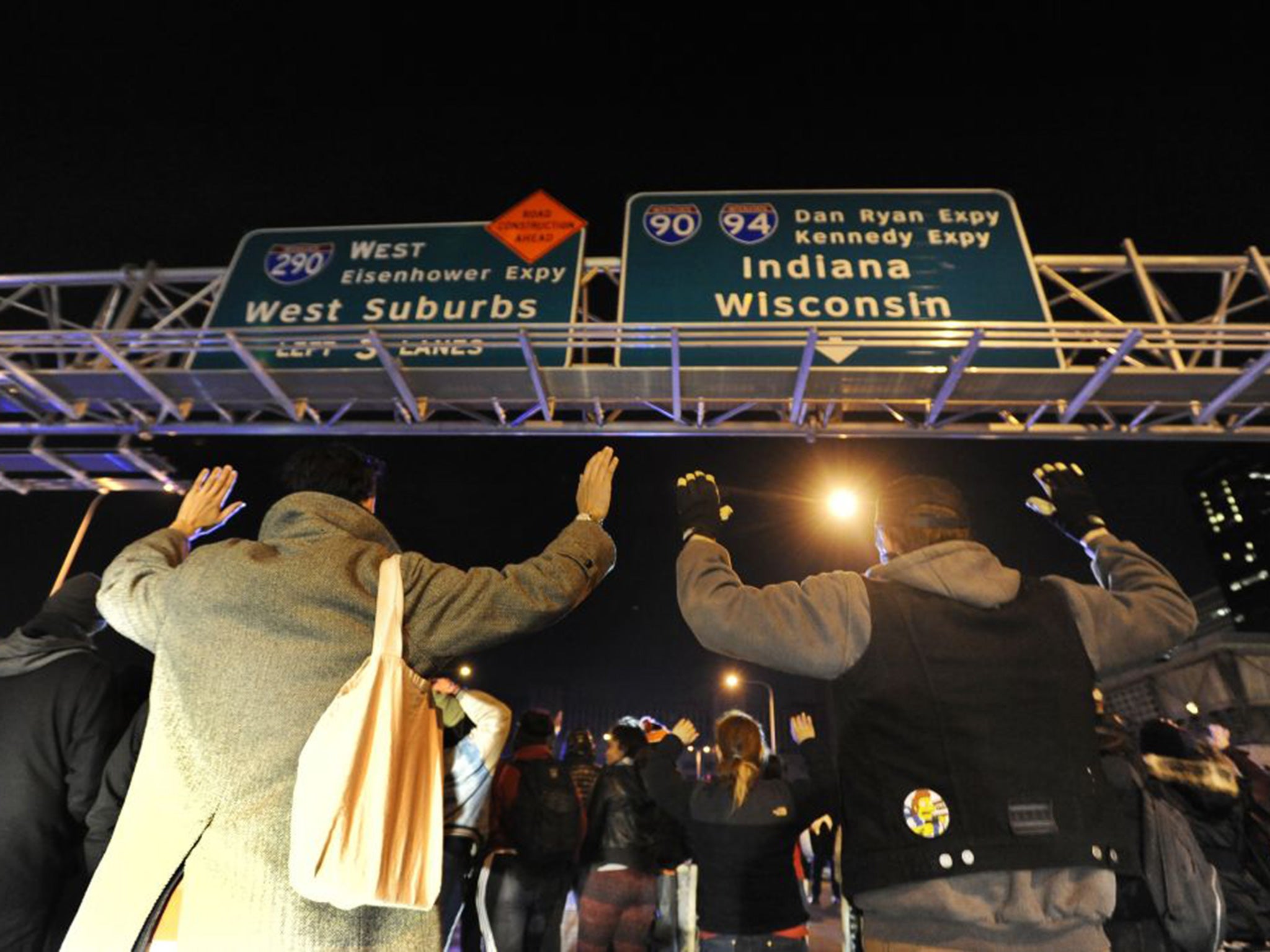 Protesters hold their hands up whilst protesting the murder of 17-year-old Laquan McDonald in Chicago