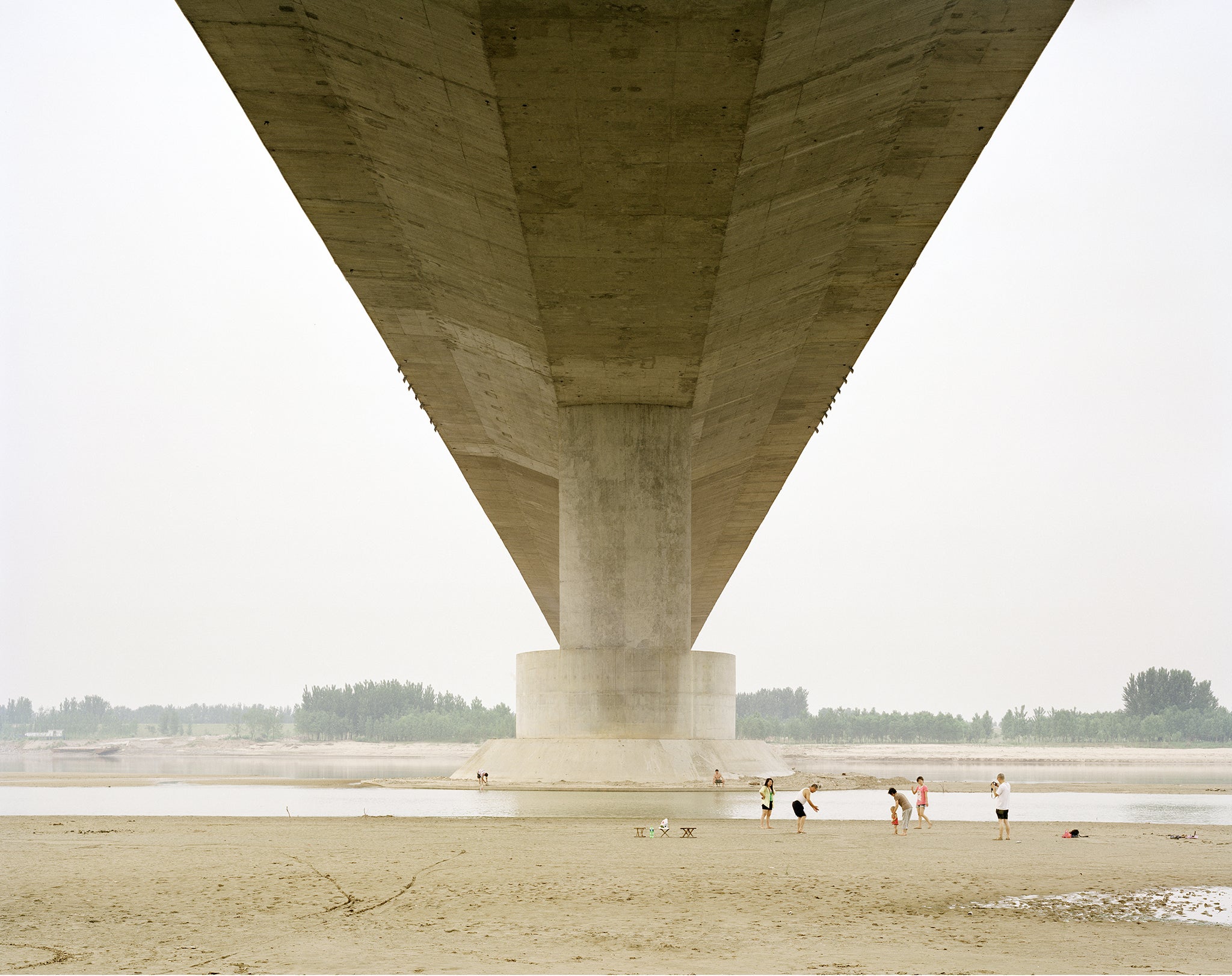 A Family Spending the Weekend Under a Bridge, 2011 by Zhang Kechun
