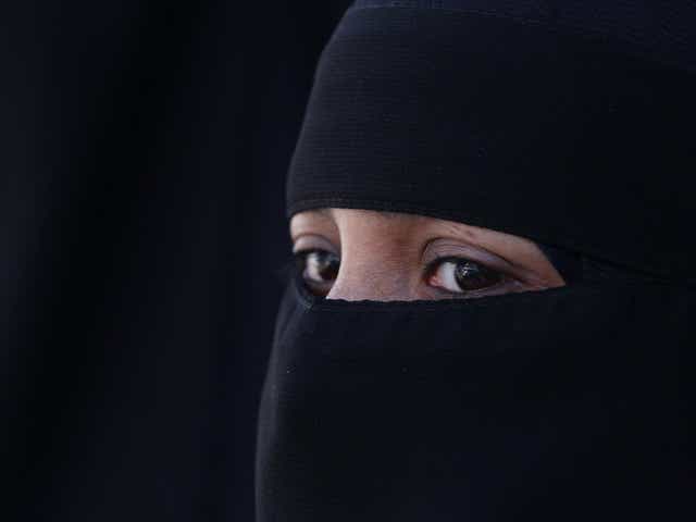 A woman wears an Islamic niqab veil
