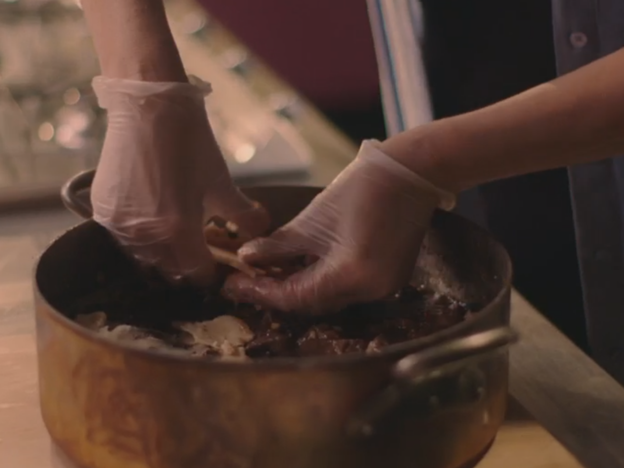 Nigella prepares a sticky dish with the help of her gloves on Simply Nigella