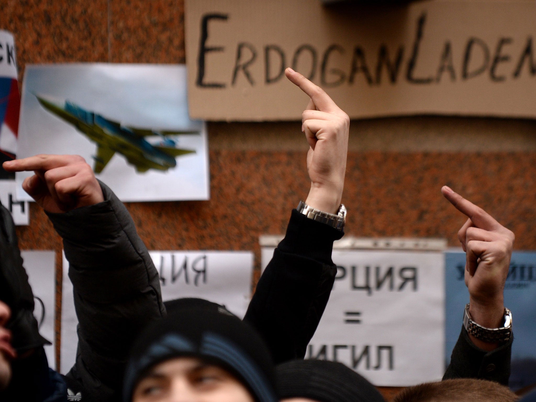 Protesters take part in an anti-Turkey picket outside the Turkish embassy in Moscow on November 25, 2015.