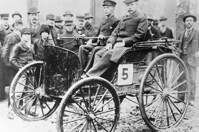J. Frank Duryea pictured in the car he co-created in Illinois, 1895
