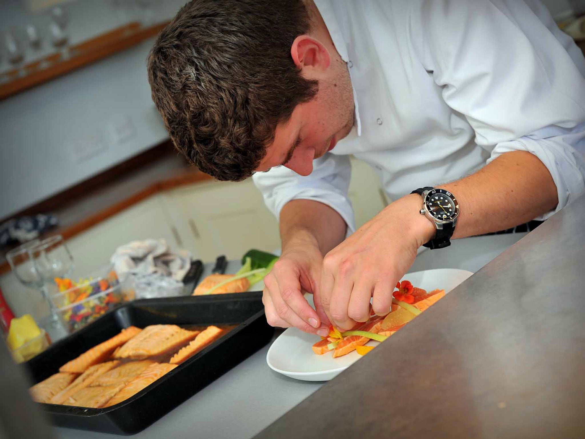 Chef Calum Munro prepares a starter dish in the kitchen at Scorrybreac House