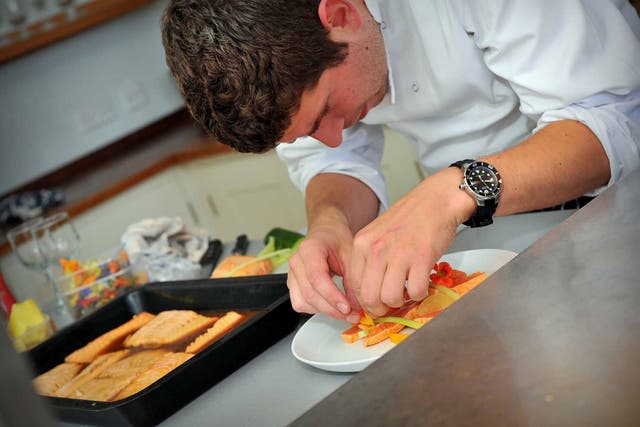 Chef Calum Munro prepares a starter dish in the kitchen at Scorrybreac House