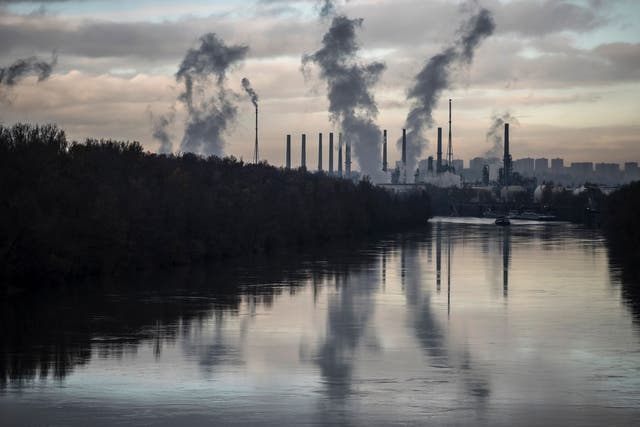 Smoke belches from an oil refinery, on November 25, 2015 at Feyzin, some 10 kilometers south of Lyon. France will be hosting the COP21, also known as 'Paris 2015' UN climate summit, from November 30 to December 11, 2015