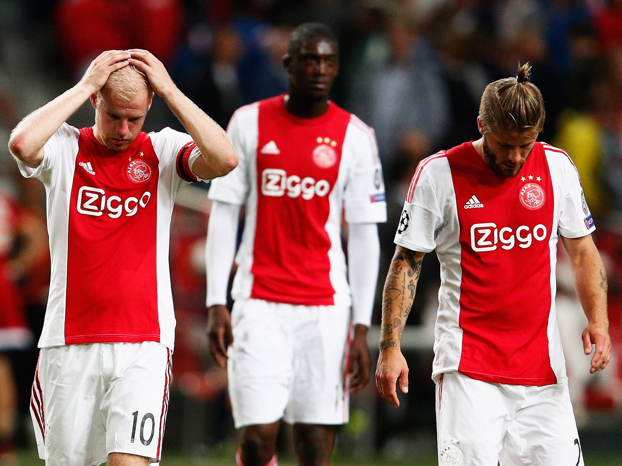 &#13;
Ajax players react after being dumped out of the Champions League at the qualifying phase earlier this season&#13;