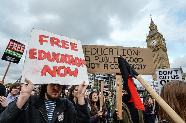 Students from across the country march during a demonstration against education cuts on 4 November through Central London