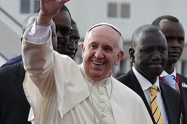 The pope greets the crowds as he touches down in Nairobi