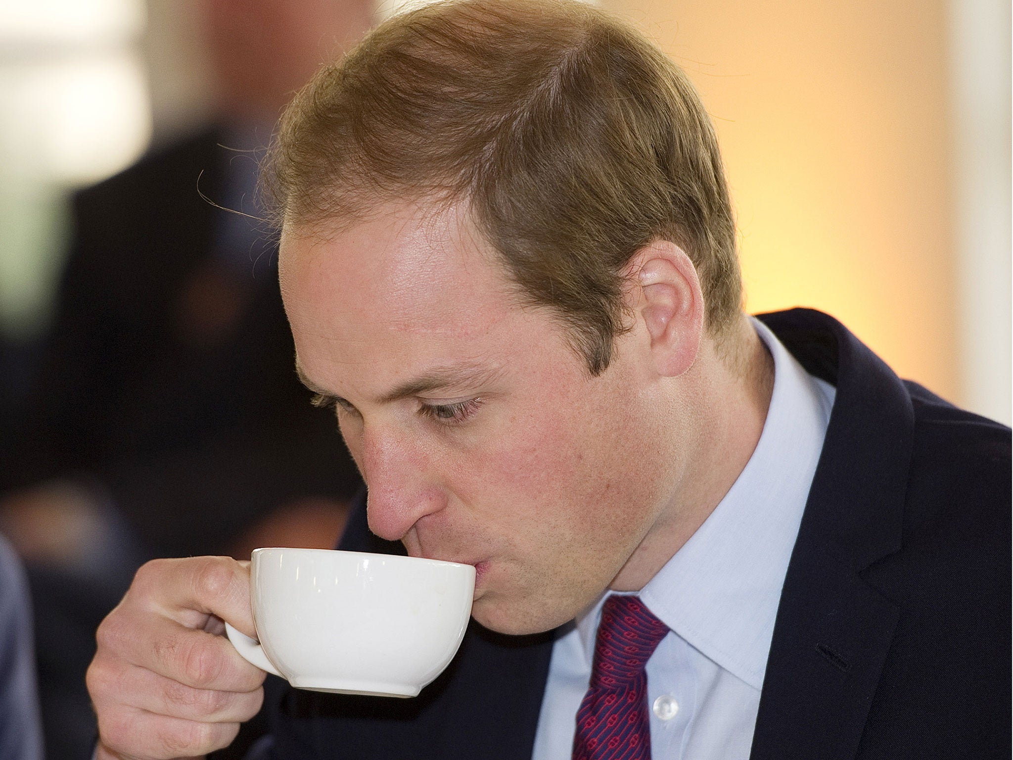 Prince William, Duke of Cambridge, drinks a cup of tea
