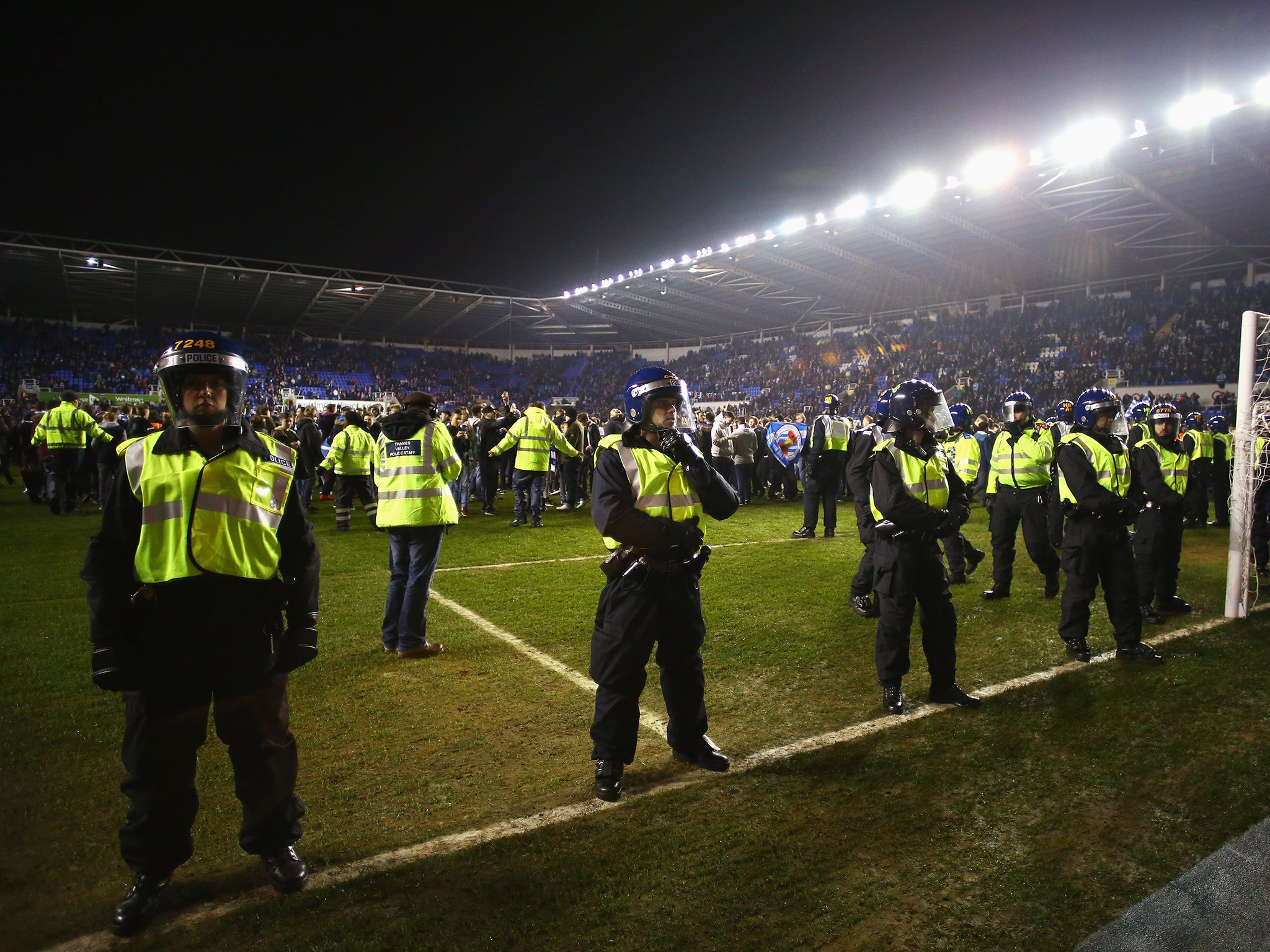 Police at Reading's ground The Madjeski Stadium following a pitch invasion