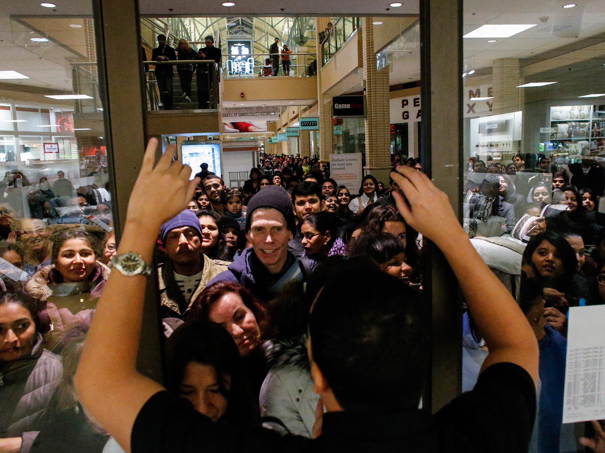 People waits in line to go shopping at the to JCPenney store at the Newport Mall on 2014's Black Friday