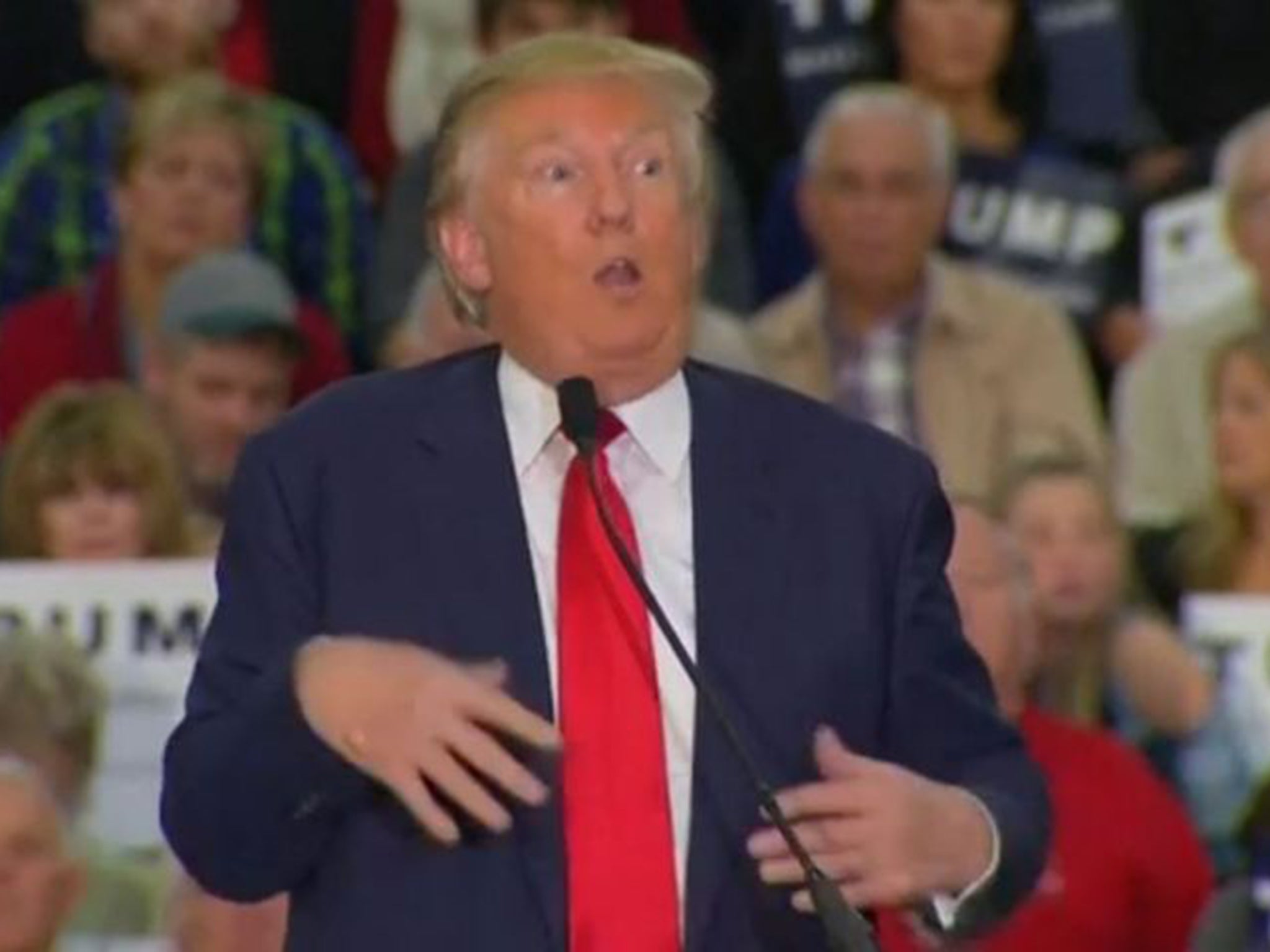 Republican presidential contender Donald Trump mocks the movements of a disabled New York Times reporter