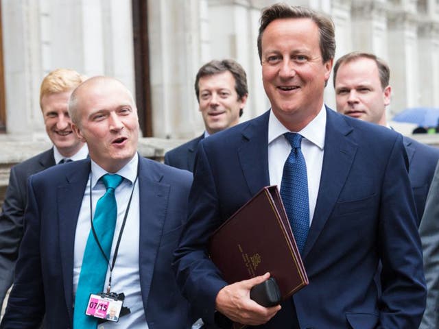 Martin with David Cameron in 2014: he prepared the Prime Minister during the Leveson inquiry and ‘Plebgate’