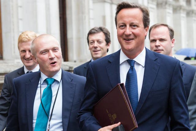 Martin with David Cameron in 2014: he prepared the Prime Minister during the Leveson inquiry and ‘Plebgate’