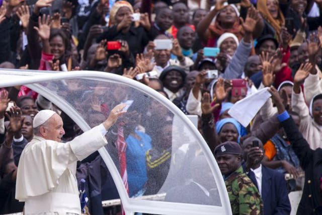Pope Francis arrives at the University of Nairobi to deliver an open-air mass