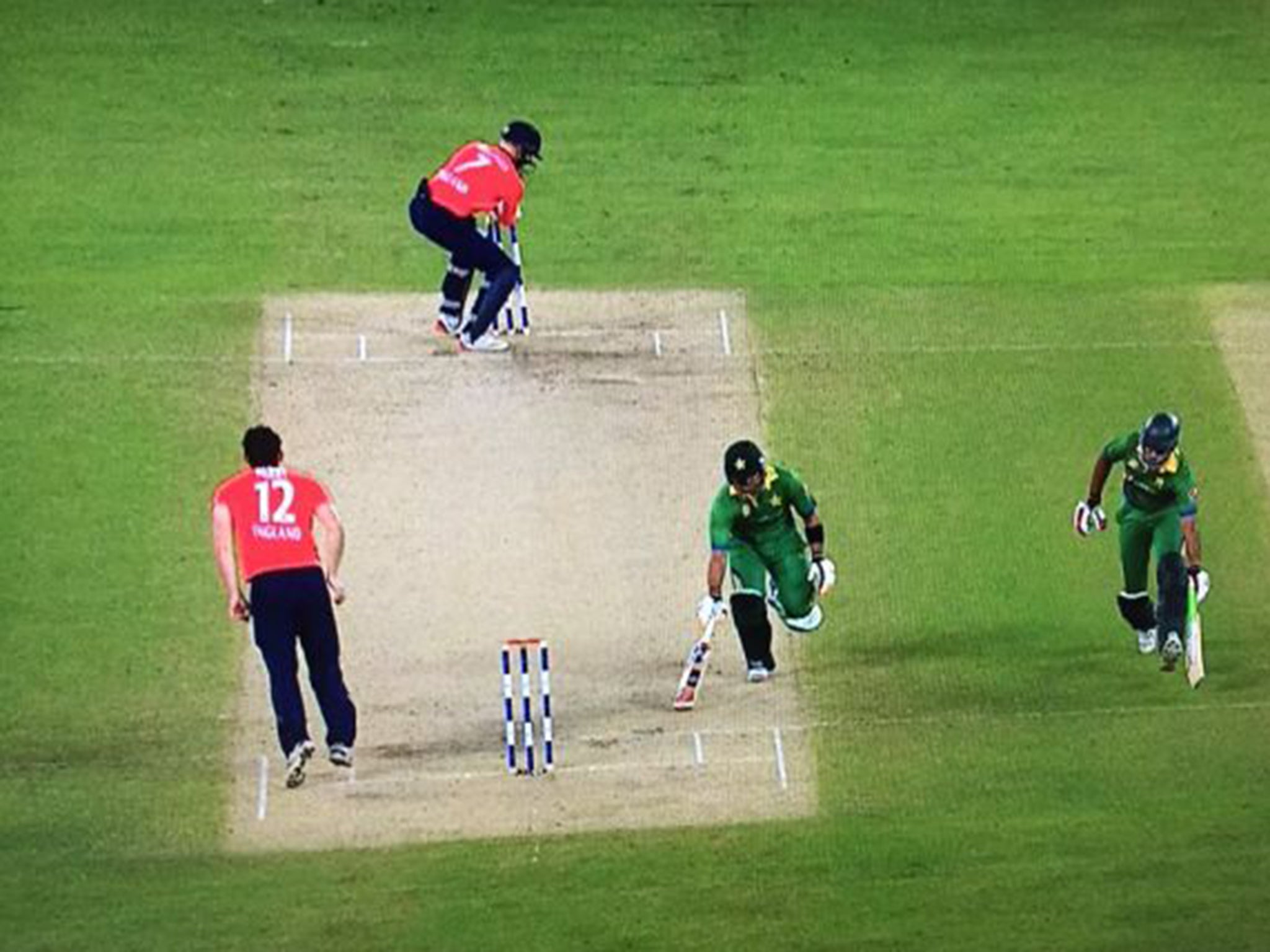 Umar Akmal is run out in farcical fashion for the home side