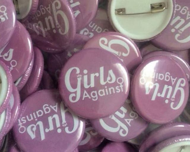 Badges printed by the group to distribute at concerts