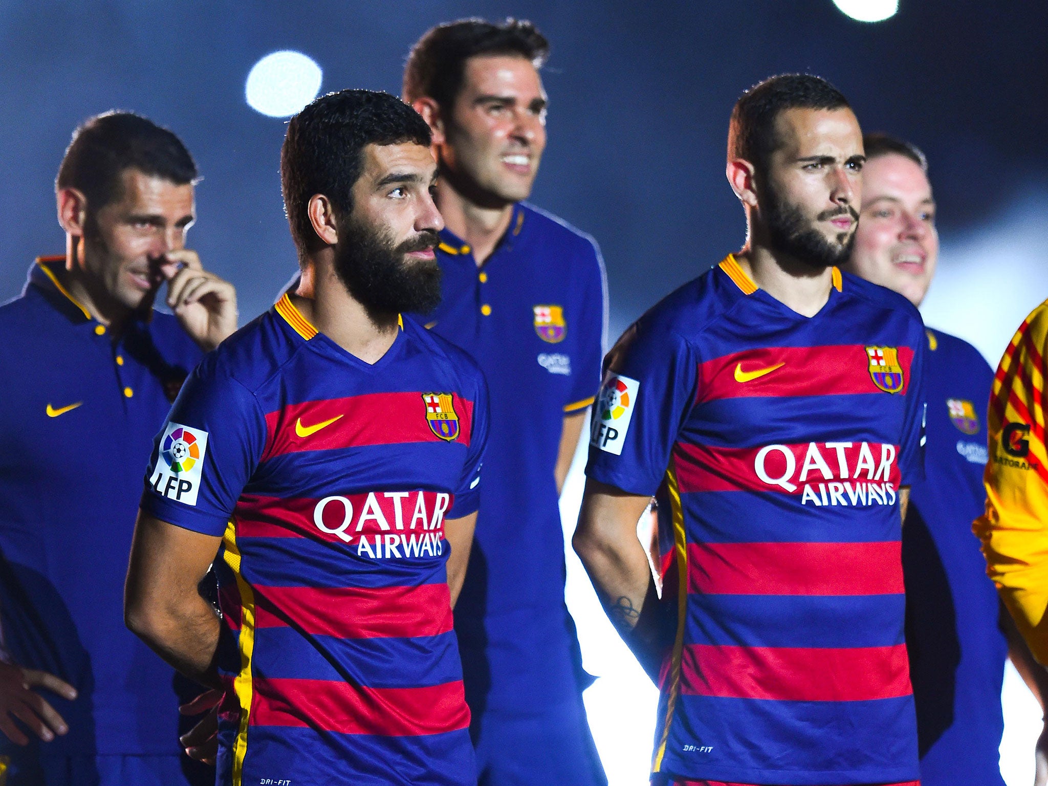 Experienced captain Arda Turan (left) struggles to get a game for Barcelona (Getty)