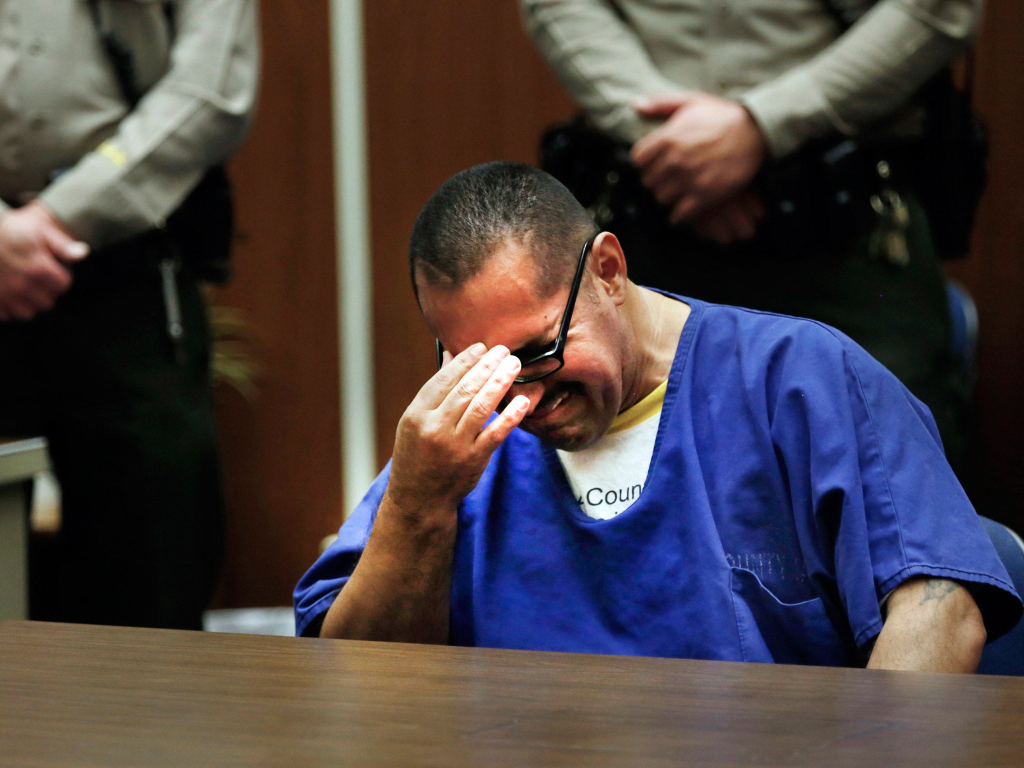 Luis Vargas, who has been in prison for 16 years, breaks down in court.